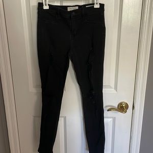 Black pacsun jeggings size 27. Ankle length with rips on both legs